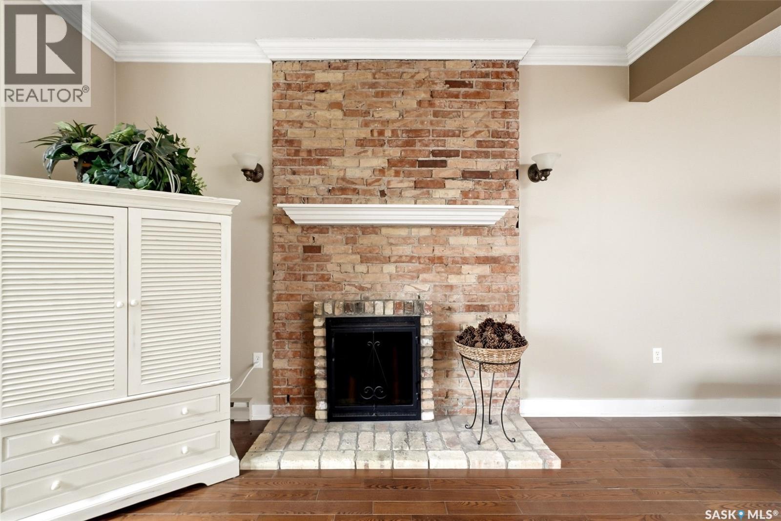305 2925 14Th Avenue, Regina, SK - Indoor Photo Showing Other Room With Fireplace