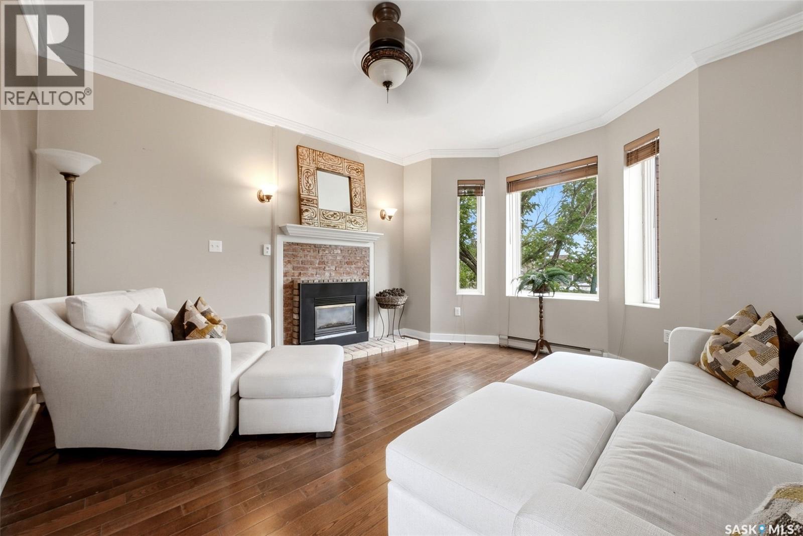 305 2925 14Th Avenue, Regina, SK - Indoor Photo Showing Living Room With Fireplace