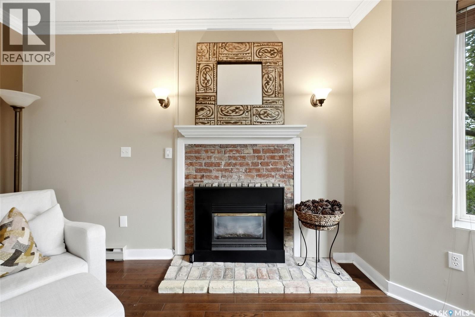 305 2925 14Th Avenue, Regina, SK - Indoor Photo Showing Living Room With Fireplace