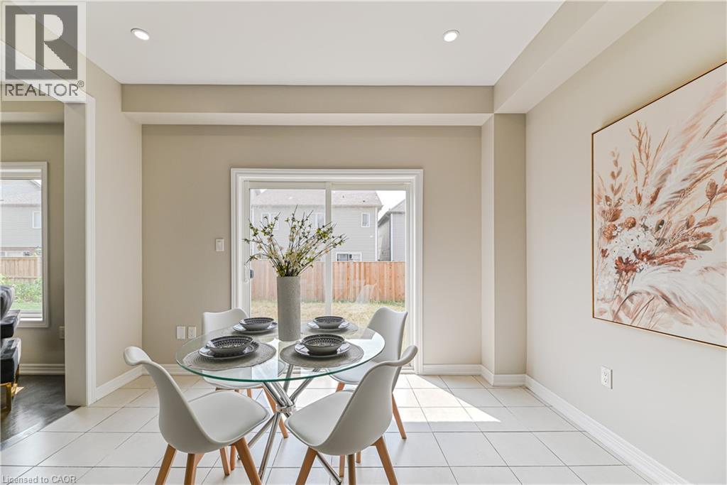 Recessed ceiling lighting, light-toned wall paint, tiled flooring, and a sliding glass door - 24 Weatherall Avenue, Cambridge, ON - Indoor Photo Showing Dining Room