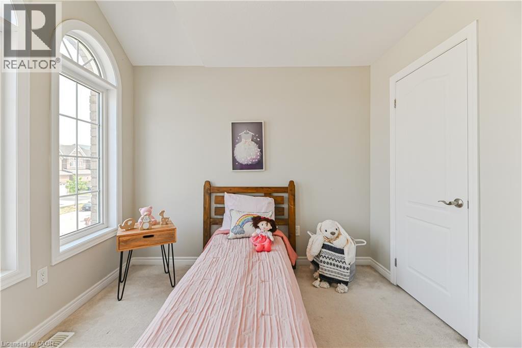 Arched window with gridded panes - 24 Weatherall Avenue, Cambridge, ON - Indoor Photo Showing Bedroom