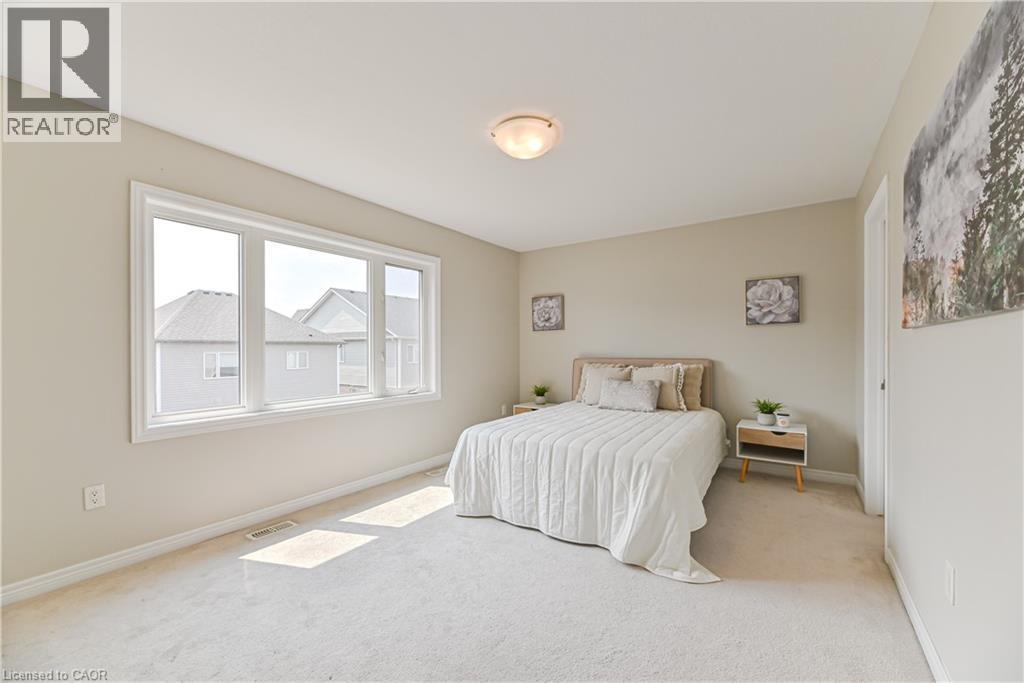 Wall-to-wall carpeting and a ceiling-mounted light fixture - 24 Weatherall Avenue, Cambridge, ON - Indoor Photo Showing Bedroom