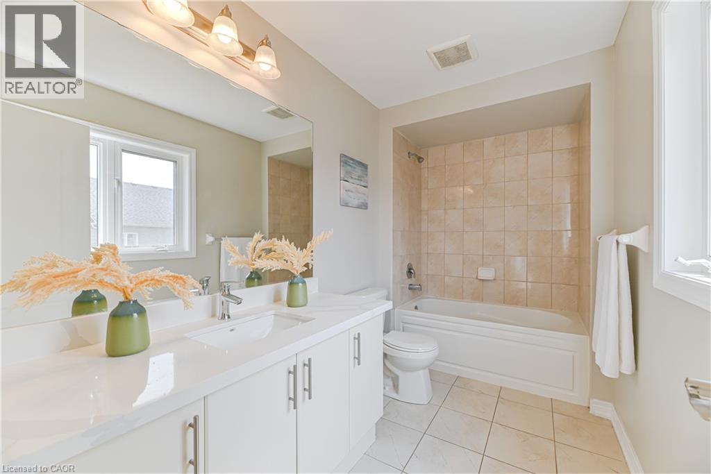 Double vanity with integrated sinks and white cabinetry - 24 Weatherall Avenue, Cambridge, ON - Indoor Photo Showing Bathroom