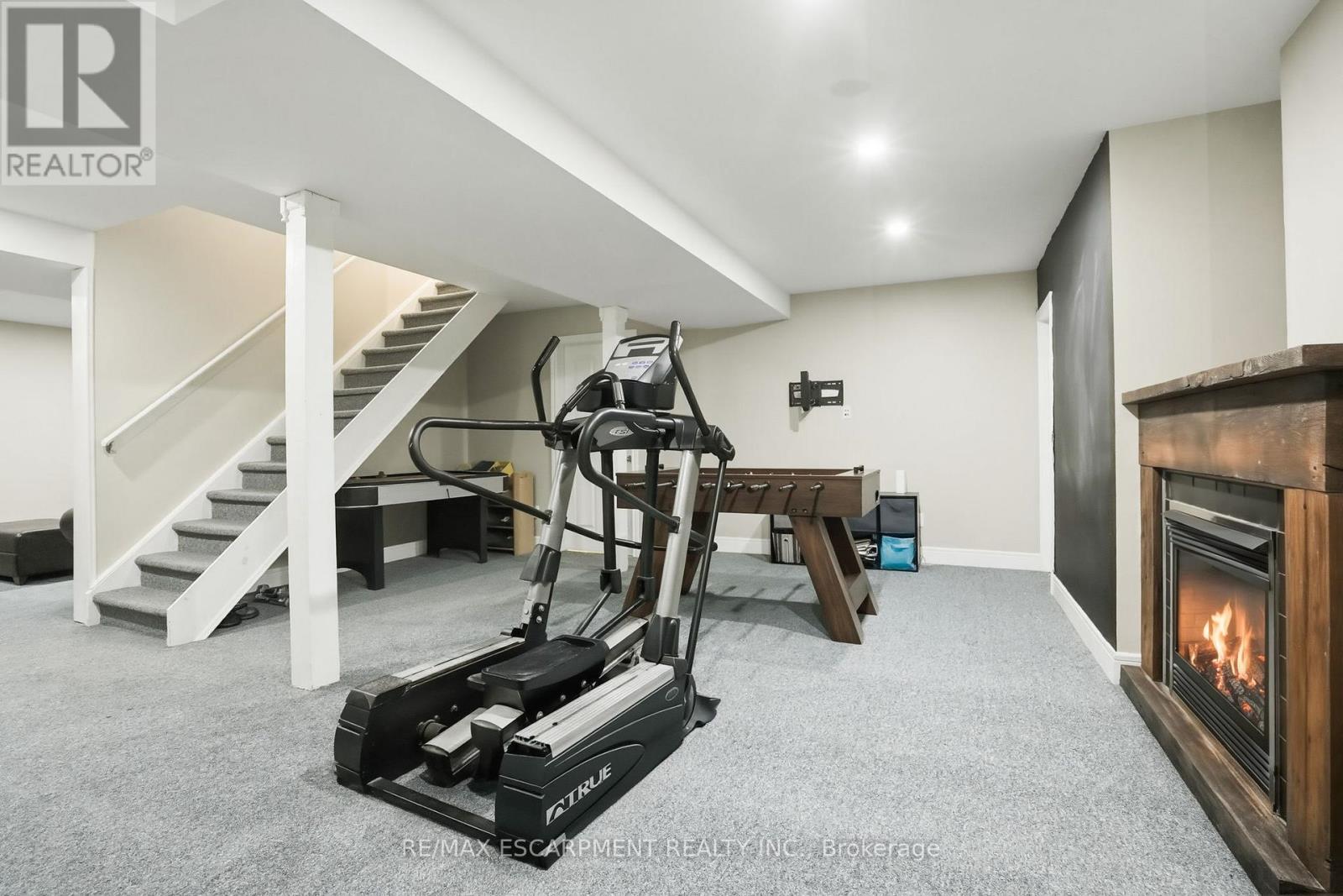 2000 15Th Side Road, Milton, ON - Indoor Photo Showing Gym Room With Fireplace