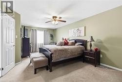 Recessed lighting, ceiling fan with light fixture, light green wall paint, textured ceiling, and carpeted flooring - 