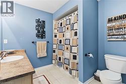 Vanity with integrated sink, stone-look countertop, and chrome faucet - 
