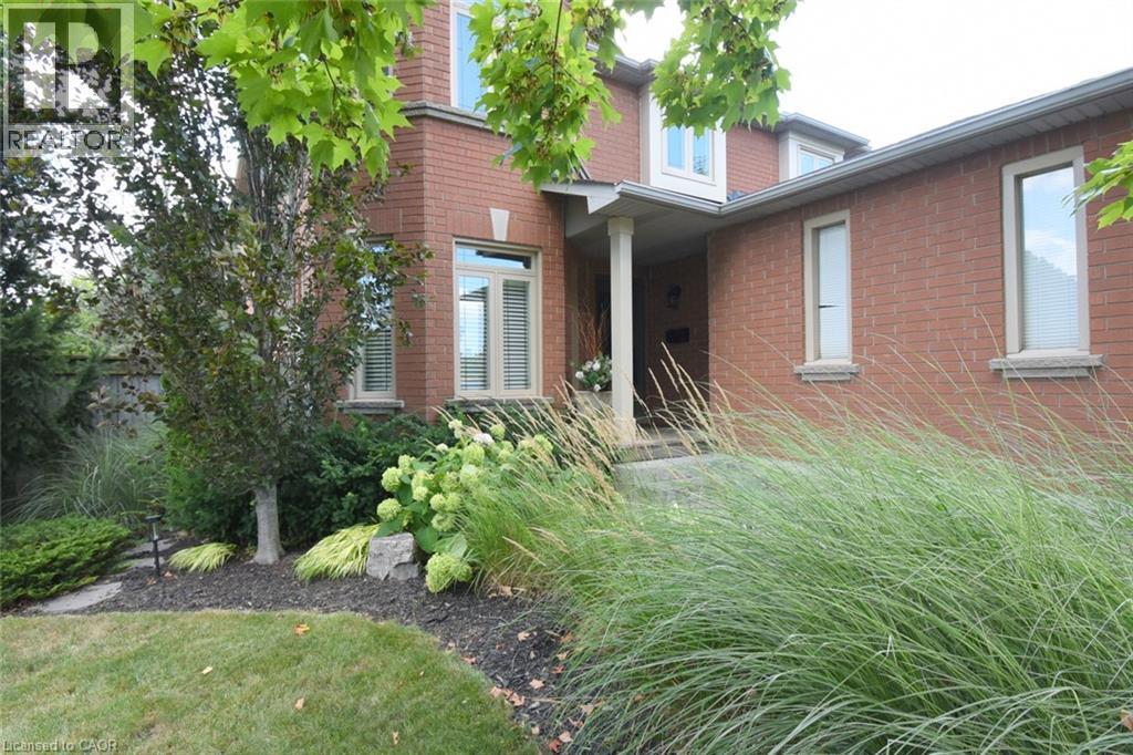 Meticulously landscaping surrounds front walkway entrance - 470 Amanda Crescent, Burlington, ON - Outdoor