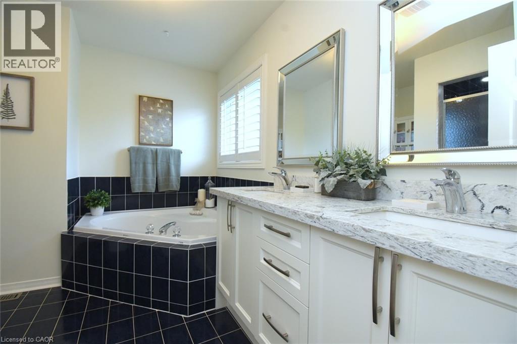 Dual vanity with integrated sinks and a light-toned countertop - 470 Amanda Crescent, Burlington, ON - Indoor Photo Showing Bathroom