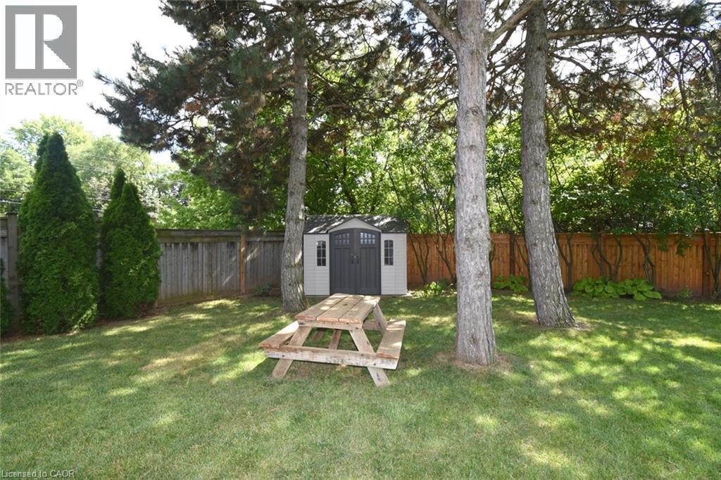 Expansive lawn area featuring mature trees and a fully fenced yard - 470 Amanda Crescent, Burlington, ON - Outdoor With Backyard