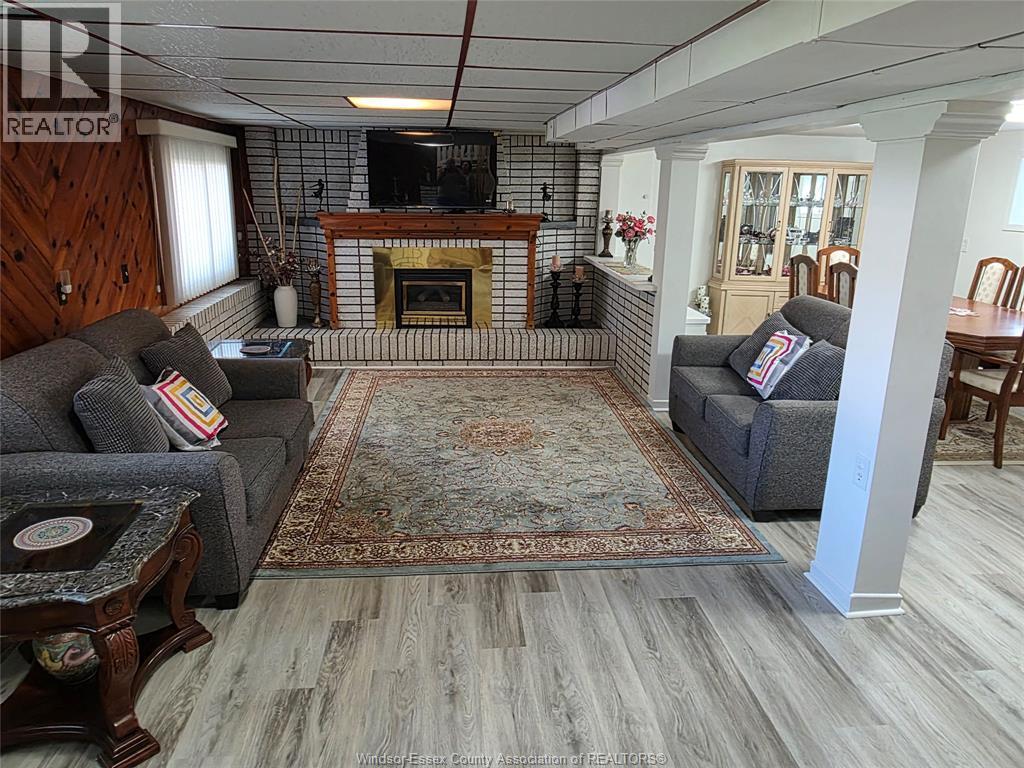 3767 Turner, Windsor, ON - Indoor Photo Showing Living Room With Fireplace