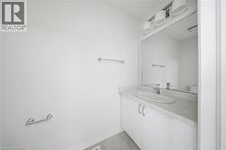 White vanity with a single basin, integrated countertop, and chrome faucet - 