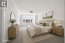 Recessed lighting, large windows, light-colored walls, ceiling-mounted fixture, and carpeting - 
