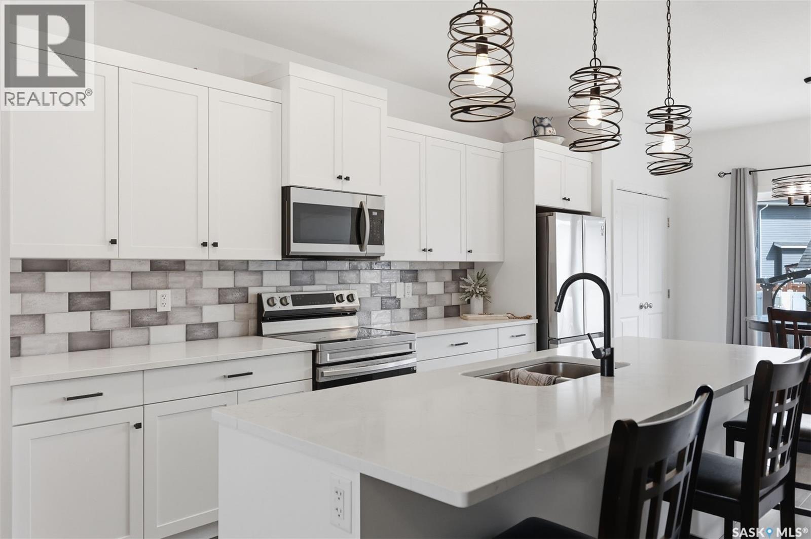 520 Brighton Gate, Saskatoon, SK - Indoor Photo Showing Kitchen With Double Sink With Upgraded Kitchen