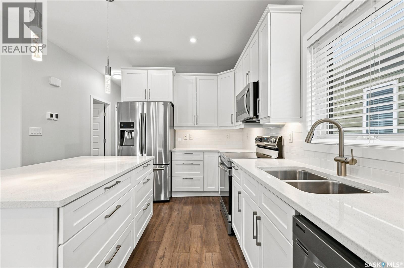 134 Bolstad Way, Saskatoon, SK - Indoor Photo Showing Kitchen With Stainless Steel Kitchen With Double Sink With Upgraded Kitchen