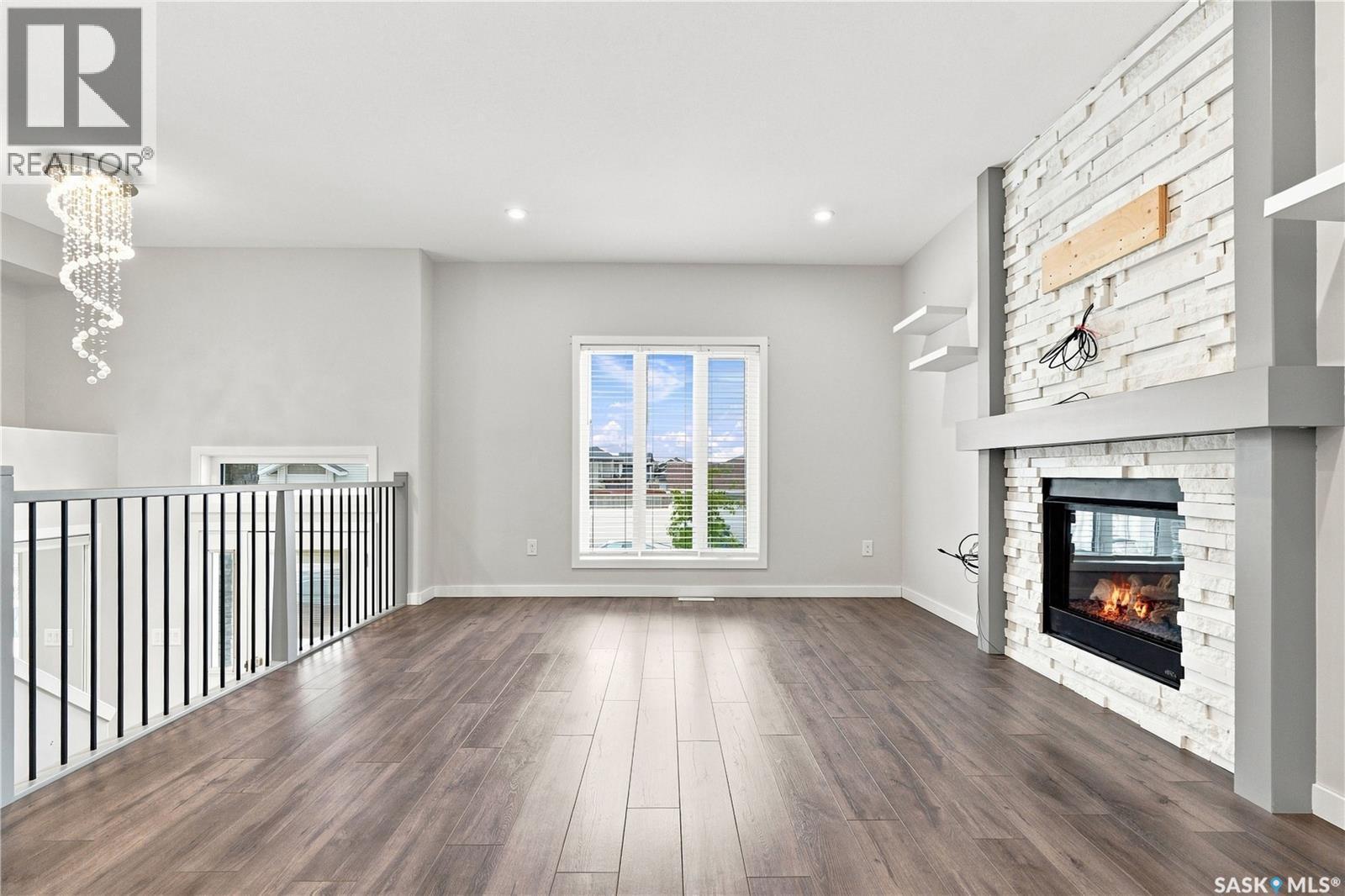 134 Bolstad Way, Saskatoon, SK - Indoor Photo Showing Other Room With Fireplace