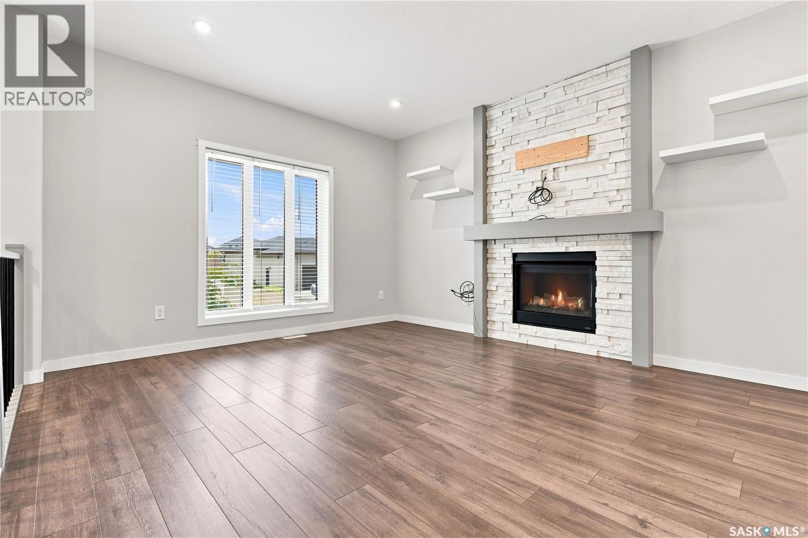 134 Bolstad Way, Saskatoon, SK - Indoor Photo Showing Living Room With Fireplace