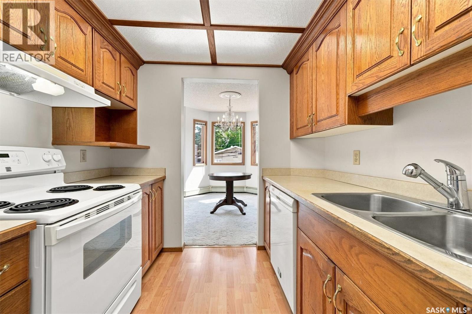 202 1215 Louise Avenue, Saskatoon, SK - Indoor Photo Showing Kitchen With Double Sink