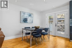 Hardwood flooring throughout, recessed lighting, and a double glass-panel door - 