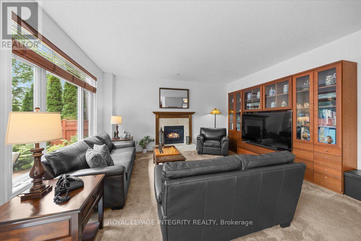 40 Bon Echo Crescent, Ottawa, ON - Indoor Photo Showing Living Room With Fireplace