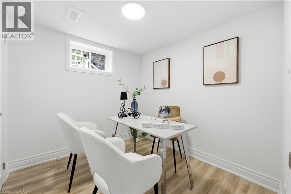 Recessed window with white trim, wood-finish flooring, white walls, and a ceiling-mounted light fixture - 156 East 36Th Street, Hamilton, ON - Indoor