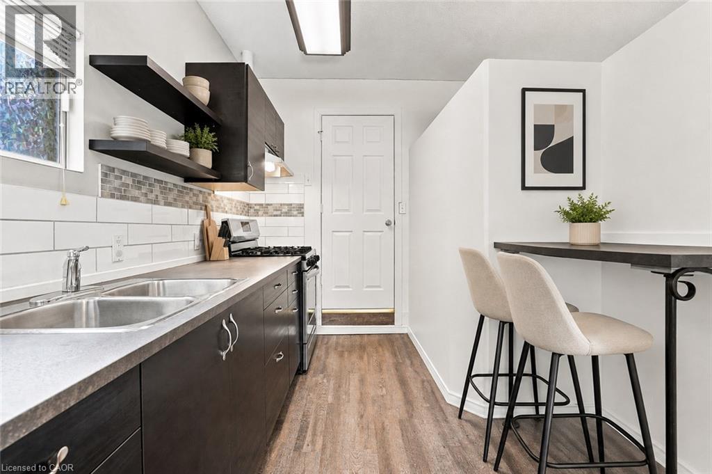 Virtually Staged - 24 Hill Street, Hamilton, ON - Indoor Photo Showing Kitchen With Double Sink