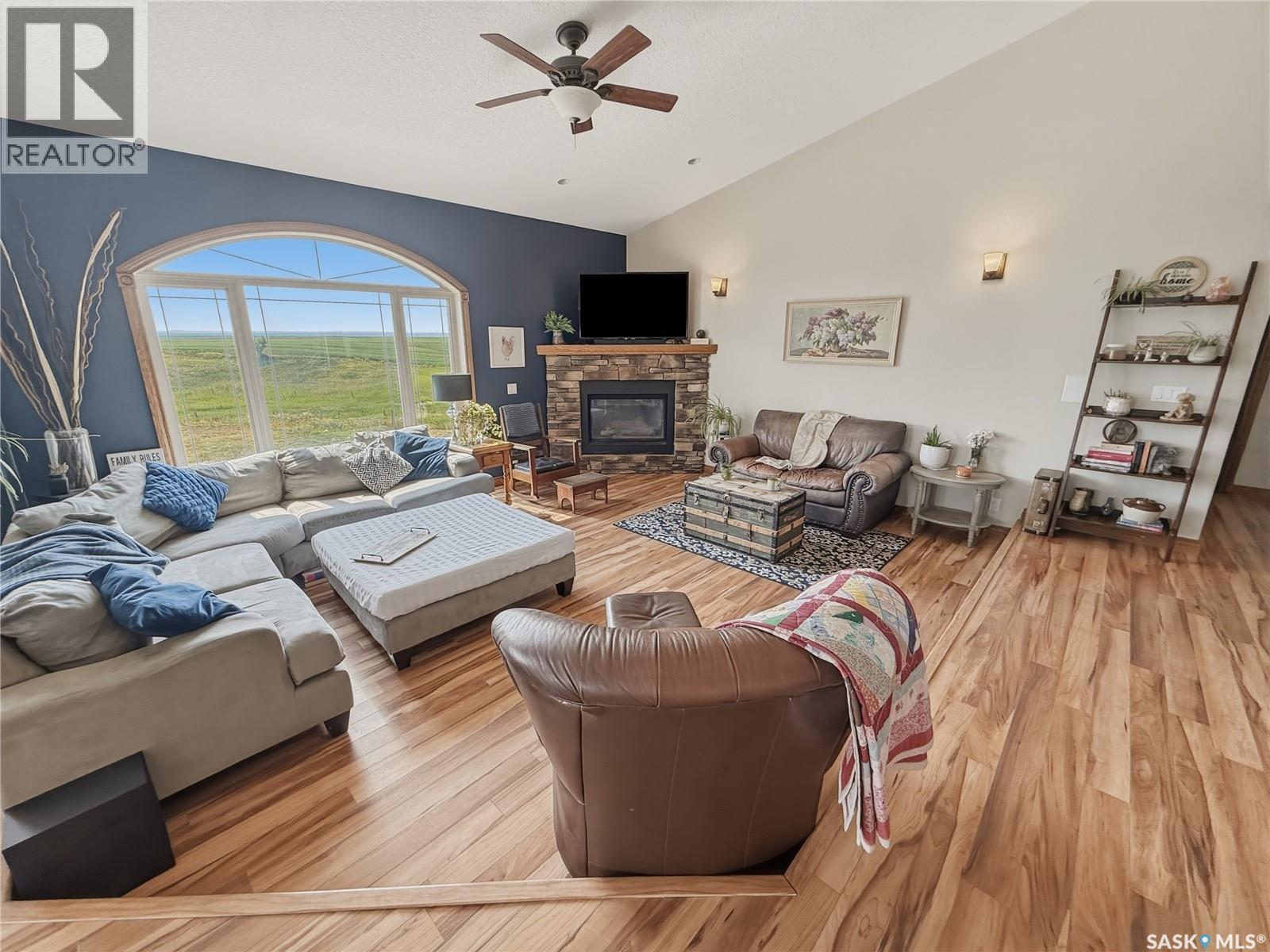 North Sk Landing Acreage, Saskatchewan Landing, SK - Indoor Photo Showing Living Room With Fireplace