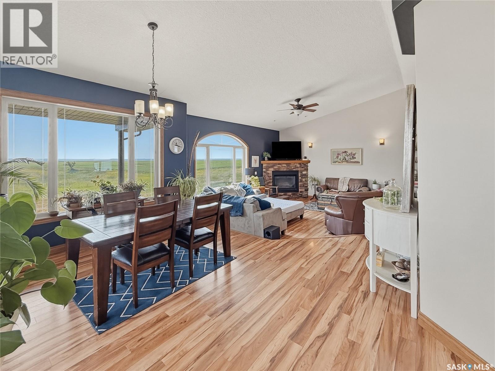 North Sk Landing Acreage, Saskatchewan Landing, SK - Indoor Photo Showing Dining Room With Fireplace