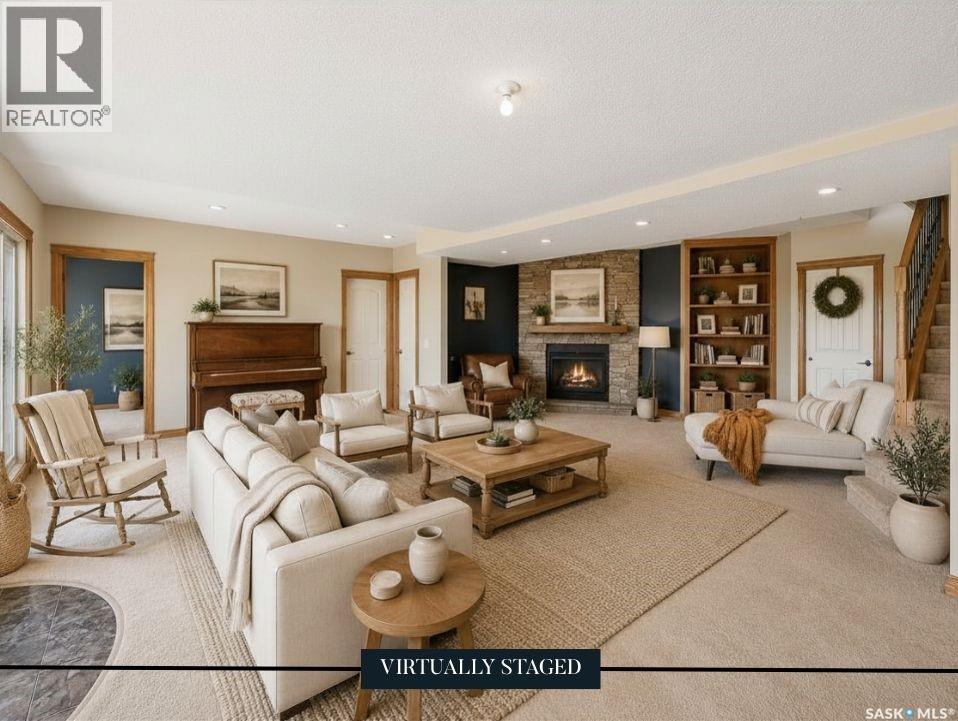 North Sk Landing Acreage, Saskatchewan Landing, SK - Indoor Photo Showing Living Room With Fireplace