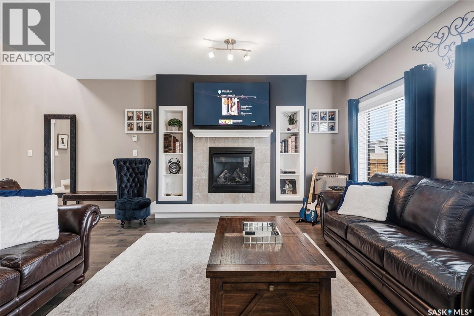 419 Kensington Boulevard, Saskatoon, SK - Indoor Photo Showing Living Room With Fireplace