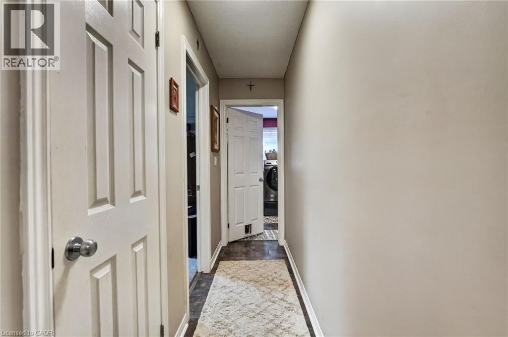 Hallway to 2nd bedroom and laundry room - 11 Rochelle Crescent, Ridgeway, ON - Indoor Photo Showing Other Room