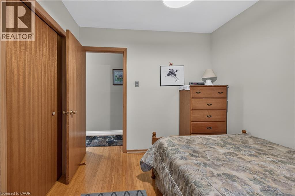 Light wood-finish flooring throughout - 5 Kentley Drive, Hamilton, ON - Indoor Photo Showing Bedroom