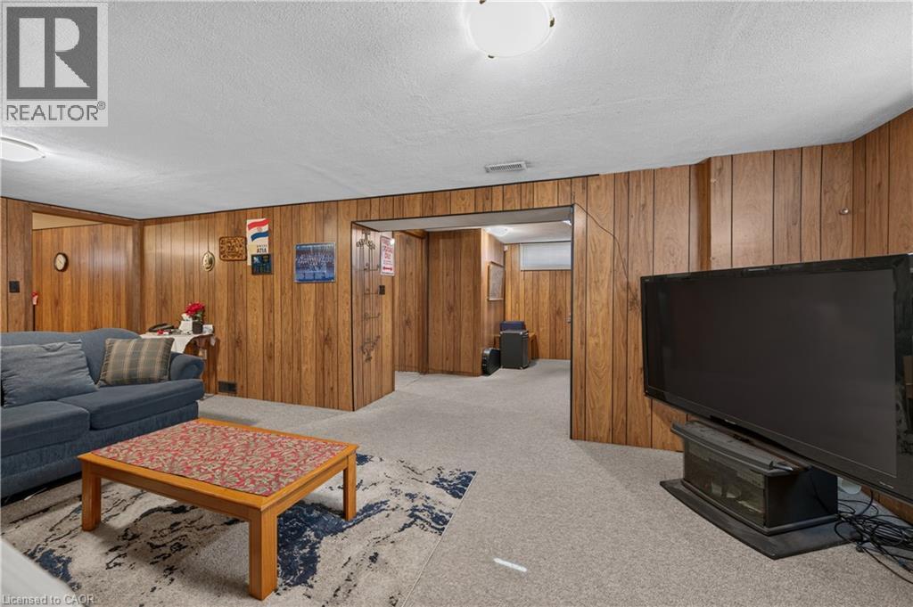 Paneling walls, carpeted flooring, and flush-mount lighting fixtures - 5 Kentley Drive, Hamilton, ON - Indoor