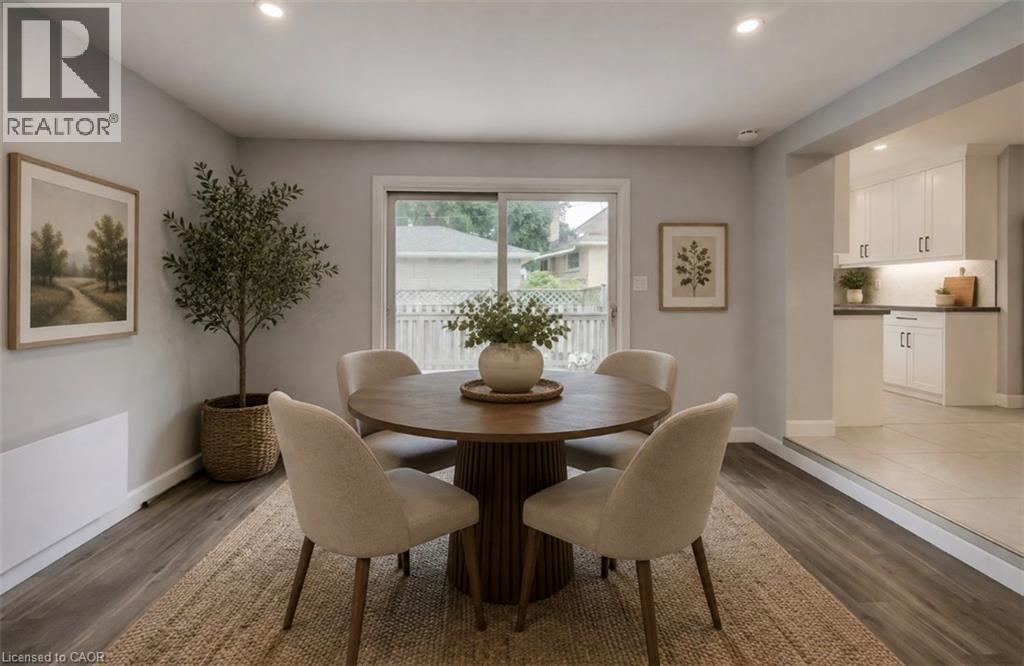 Wood-finish flooring with recessed lighting, and a sliding glass door - 244 Royal Street, Waterloo, ON - Indoor Photo Showing Dining Room