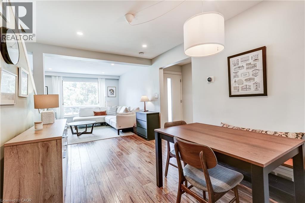 Wood-finish flooring, recessed lighting, and a drum pendant light fixture - 2488 Brookhurst Road, Mississauga, ON - Indoor Photo Showing Dining Room