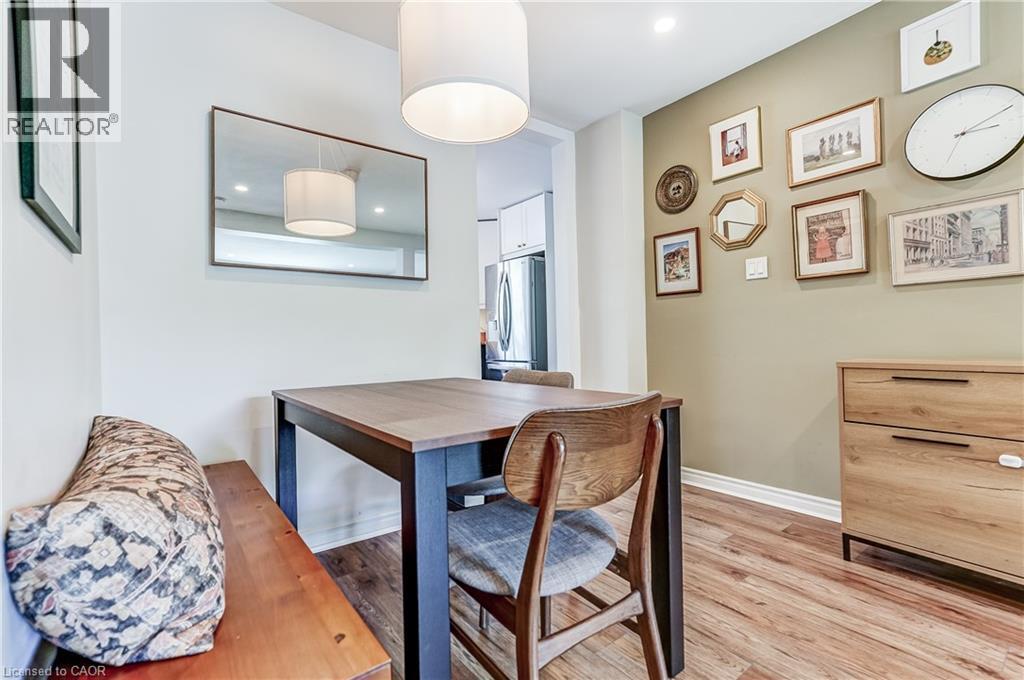 Wood-finish flooring with crisp white baseboards - 2488 Brookhurst Road, Mississauga, ON - Indoor
