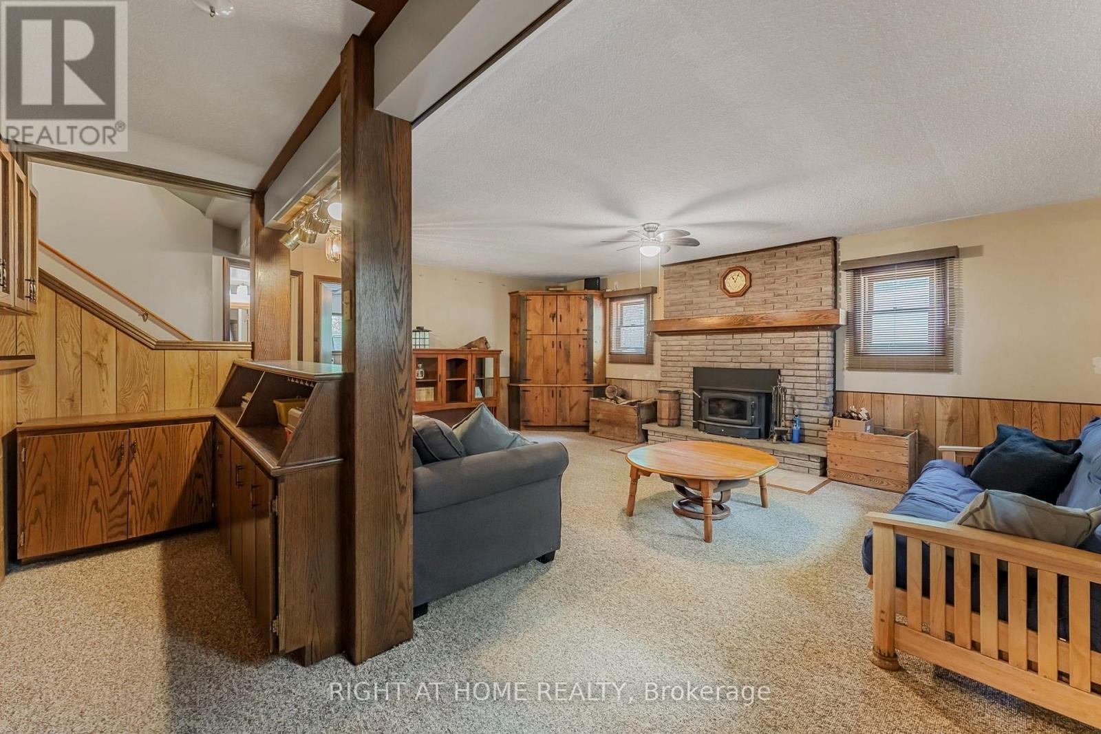 3500 Baldwick Lane, Springwater, ON - Indoor Photo Showing Living Room With Fireplace