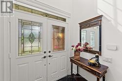 Front Foyer W Lg W/I Closet&Elegant Oak Staircase - 