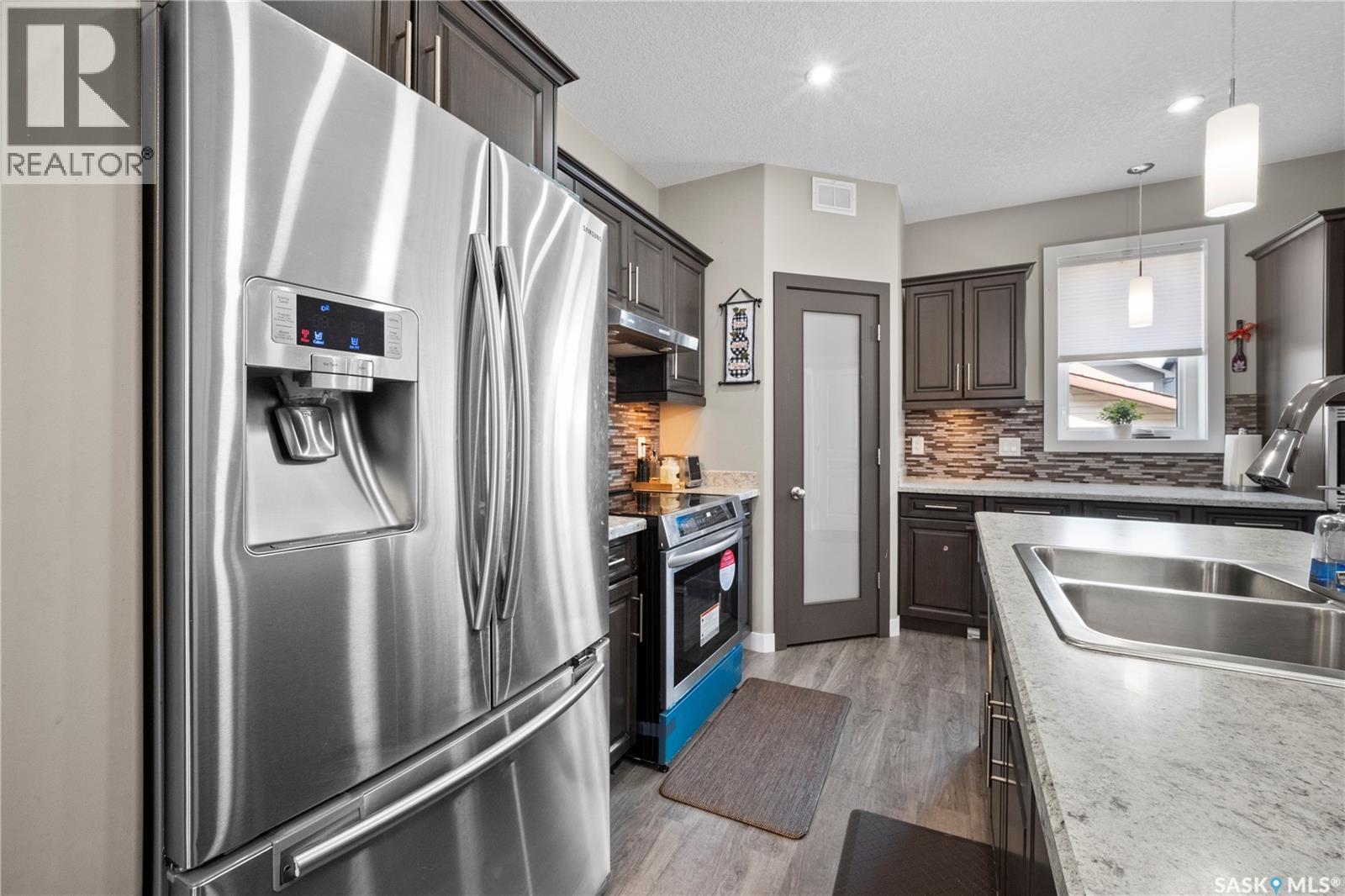 8726 Archer Lane, Regina, SK - Indoor Photo Showing Kitchen With Stainless Steel Kitchen With Double Sink With Upgraded Kitchen