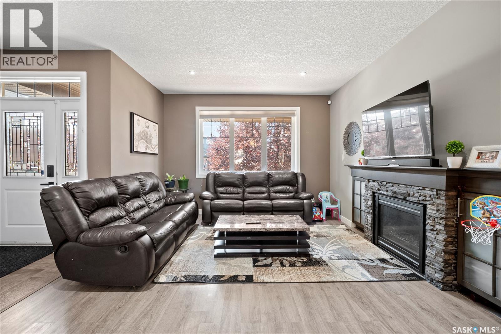 8726 Archer Lane, Regina, SK - Indoor Photo Showing Living Room With Fireplace