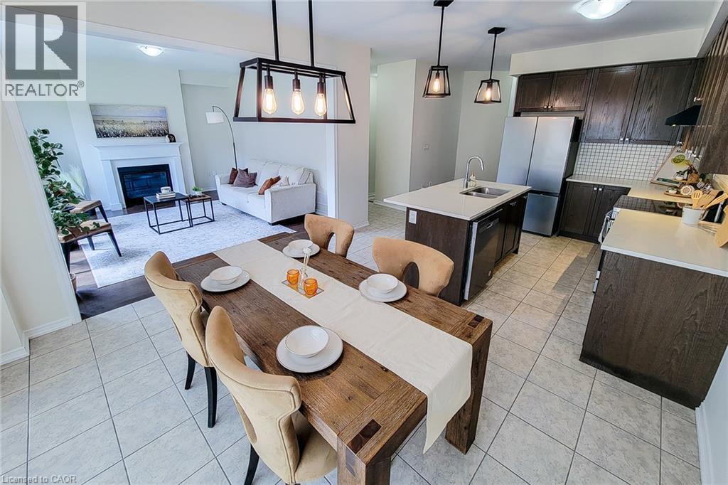 Open-concept kitchen and dining area with tile flooring - 11 Esther Crescent, Thorold, ON - Indoor With Fireplace