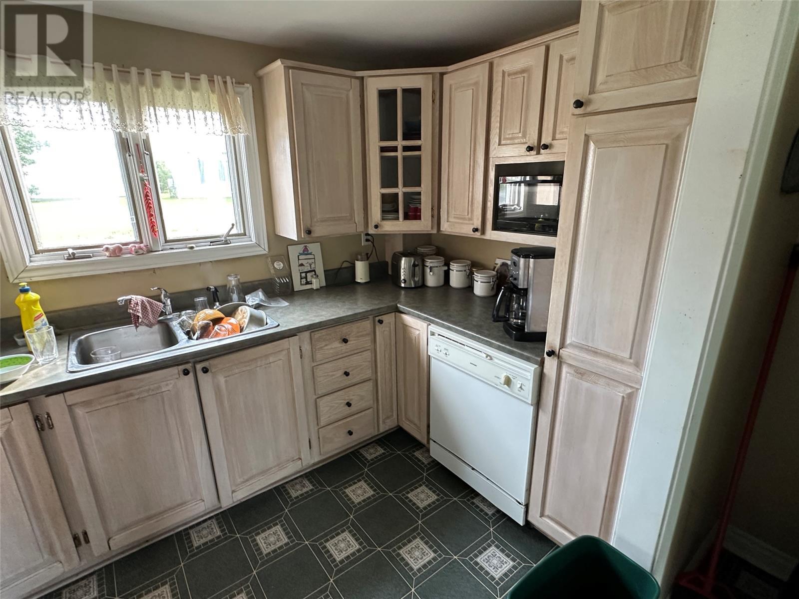 32 Marsh Road, Hants Harbour, NL - Indoor Photo Showing Kitchen With Double Sink