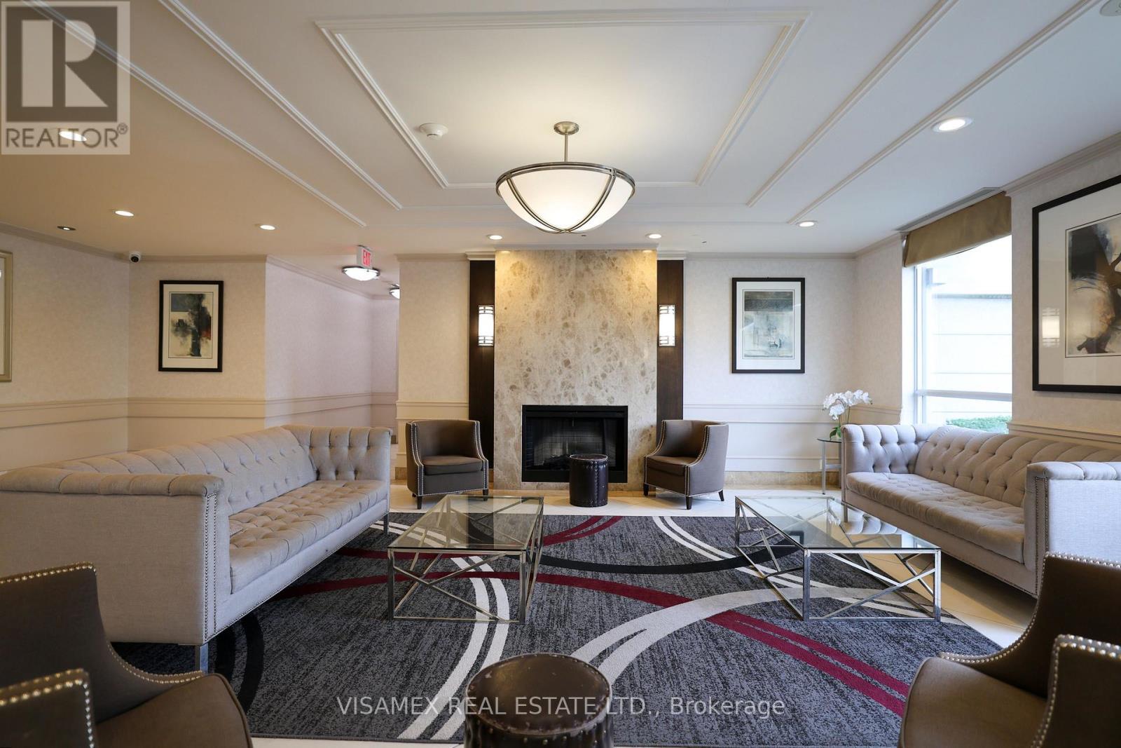 210 - 20 North Park Road, Vaughan, ON - Indoor Photo Showing Living Room With Fireplace