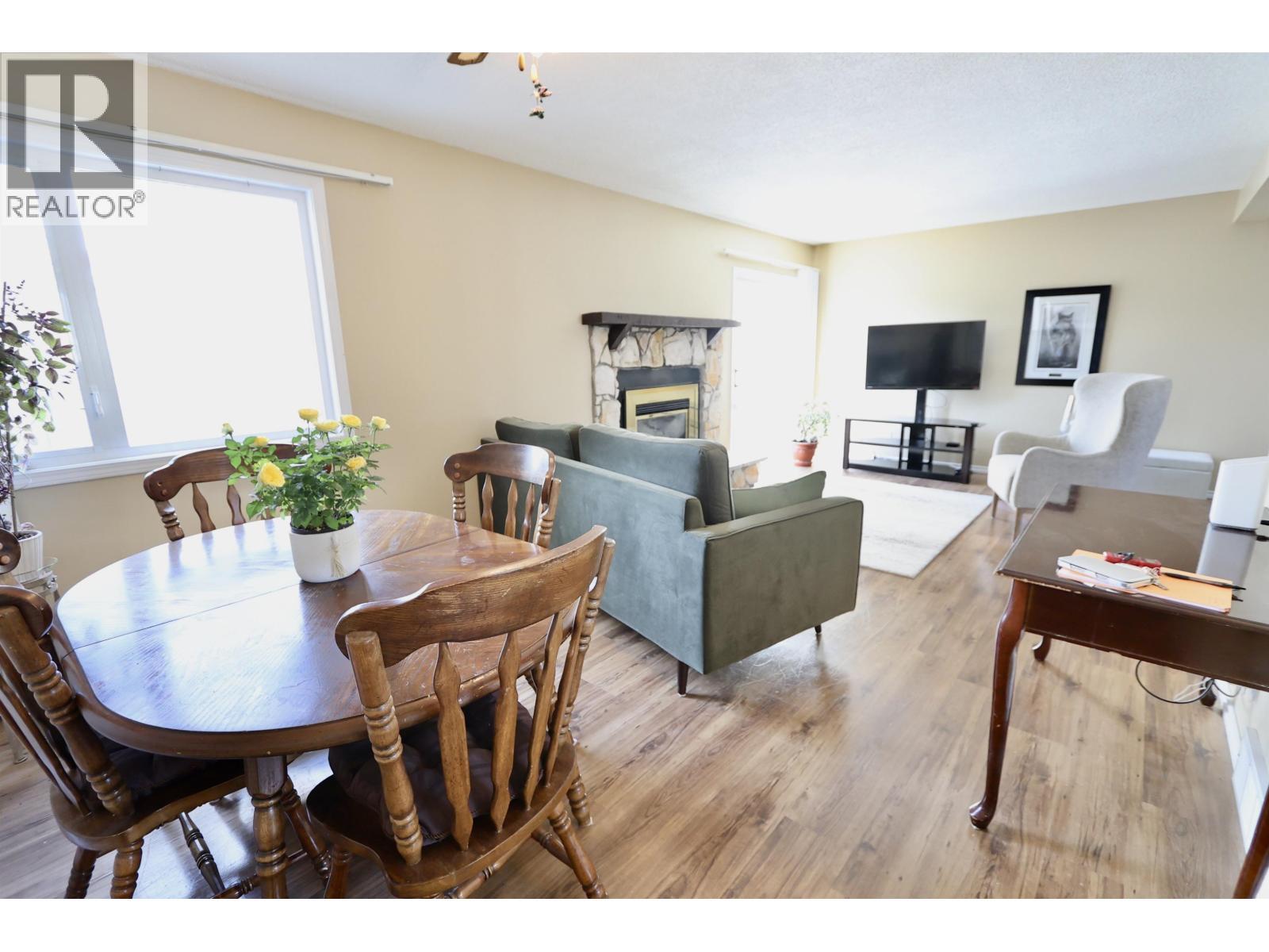 111 Tabor Boulevard, Prince George, BC - Indoor Photo Showing Dining Room With Fireplace