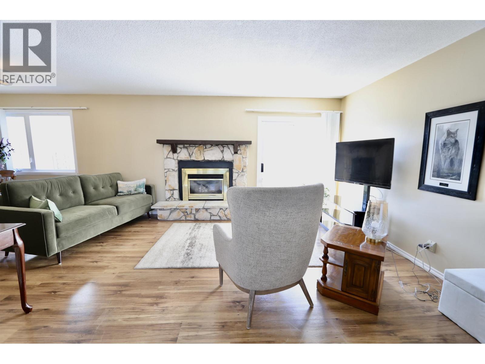111 Tabor Boulevard, Prince George, BC - Indoor Photo Showing Living Room With Fireplace