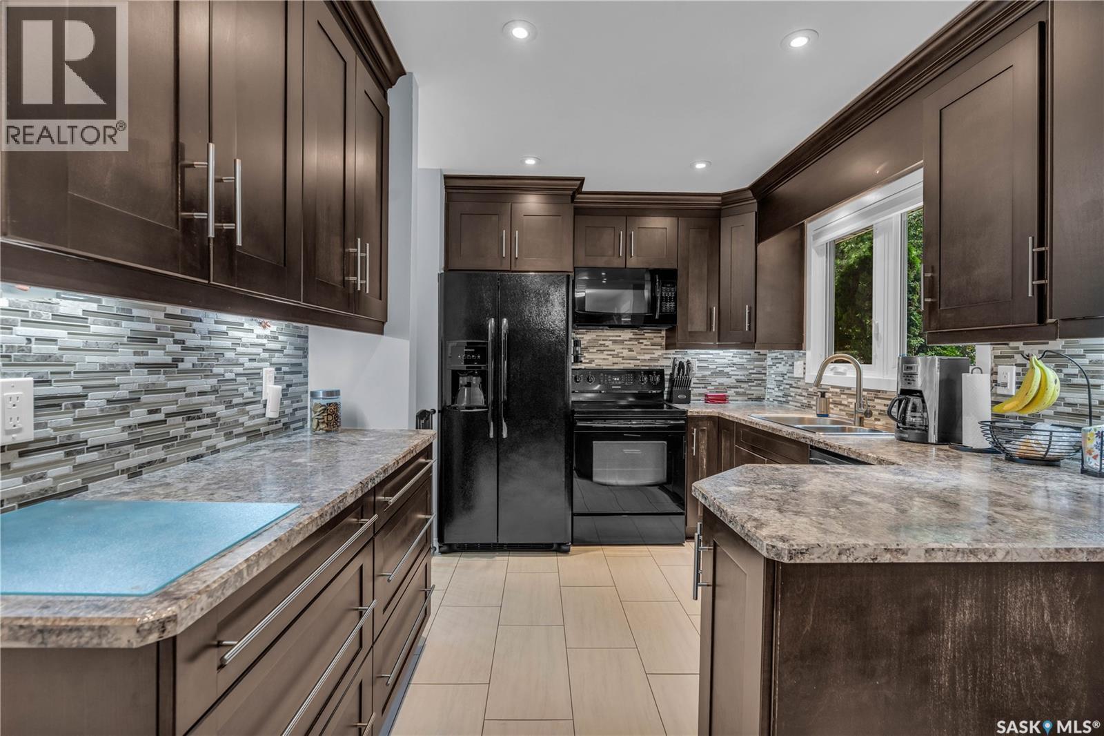 26 Fyfe Street, Regina, SK - Indoor Photo Showing Kitchen With Double Sink