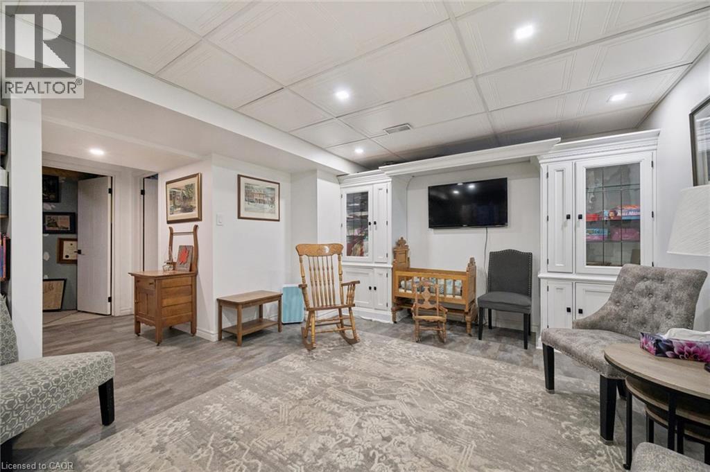 Recessed lighting, wood-finish flooring, white built-in cabinetry, and white paneled ceiling - 439 Beaver Creek Road, Waterloo, ON - Indoor