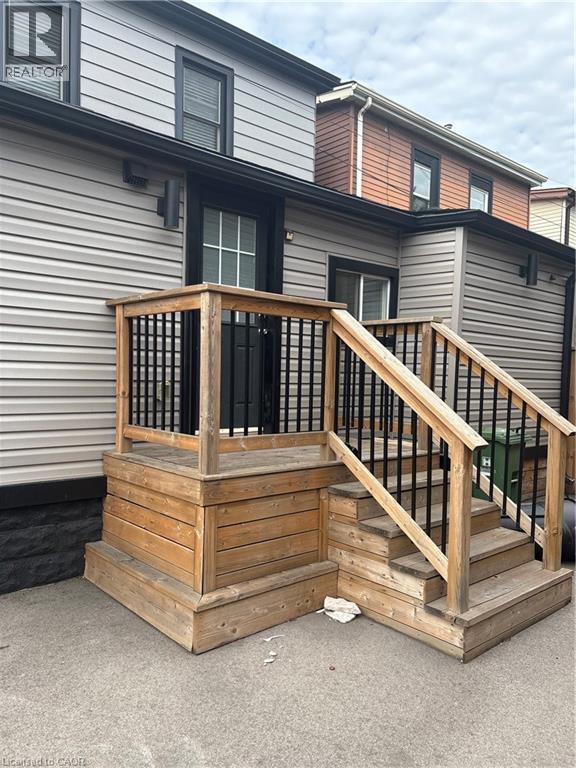 Rear view of property with a deck and stairs - 1090 Cannon Street E Unit# 2, Hamilton, ON - Outdoor With Exterior
