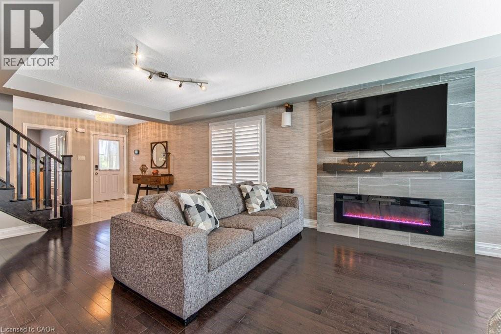 76 Ruhl Drive S, Milton, ON - Indoor Photo Showing Living Room With Fireplace