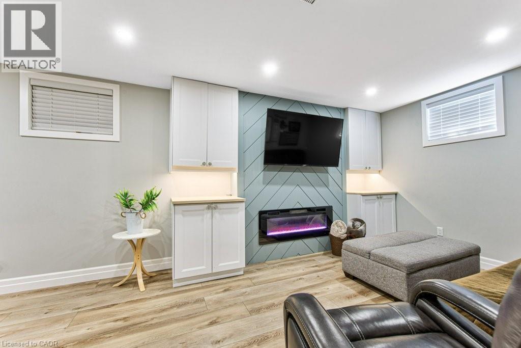 76 Ruhl Drive S, Milton, ON - Indoor Photo Showing Basement With Fireplace