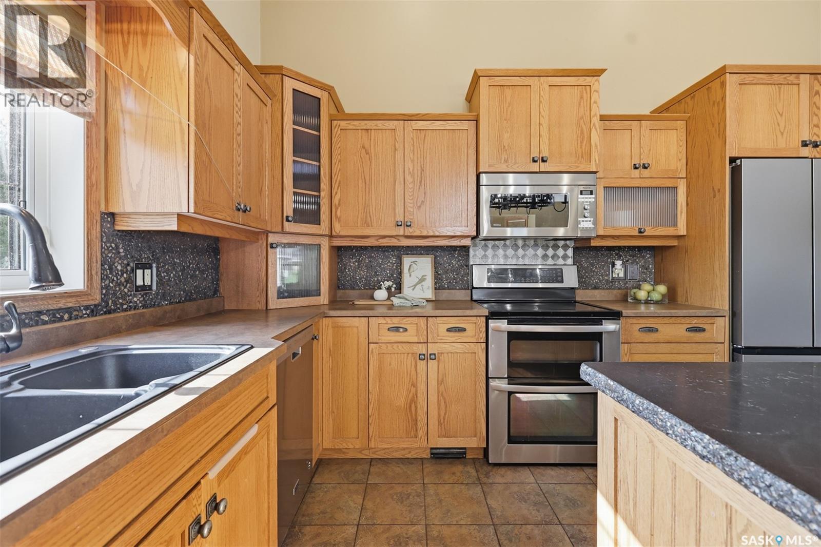 703 Beechmont Lane, Saskatoon, SK - Indoor Photo Showing Kitchen With Double Sink